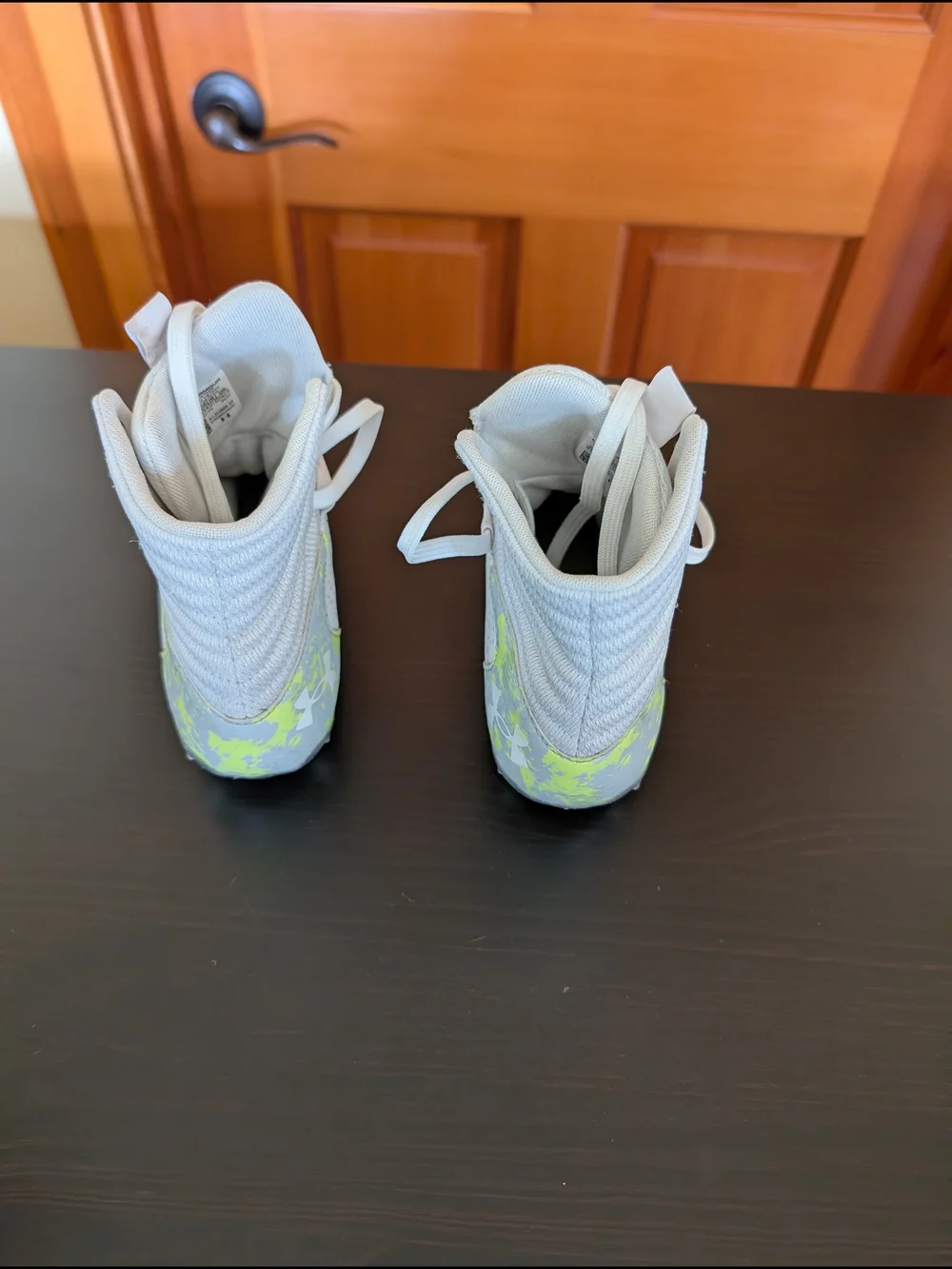 Under Armour Kids White High-Top Cleats with Neon Yellow Accent